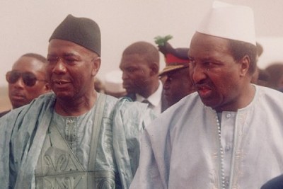 President Ahmed Tejan Kabbah of Sierra Leone, in blue, and Alpha Konare, president of Mali,during the reinstatement of Kabbah in 1998.