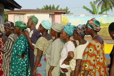 Women queue to vote in Freetown (file photo).