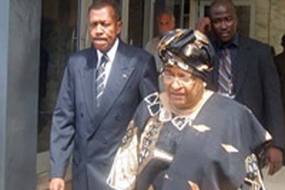 President Sirleaf followed by Former Chief Justice Johnny Lewis.