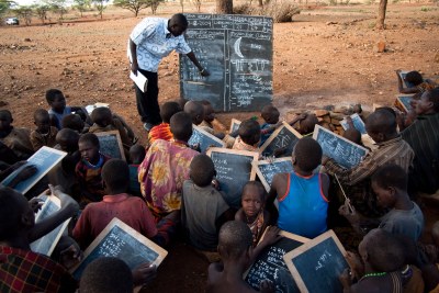 Instead of using notbooks and pens, teachers and students in Karamoja, Uganda turn to chalk boards (file photo).