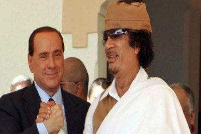 Gaddafi and Italian Prime Minister Silvio Berlusconi.
