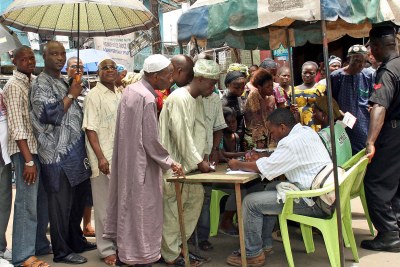 Nigerians queueing to vote.
