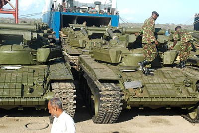 Kenyan military officers inspect some tanks after they were offloaded from the mv Faina, which had been hijacked by Somali pirates off the coast of Somalia.