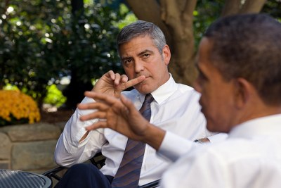U.S. President Barack Obama discusses the situation in Sudan with actor George Clooney in 2010.