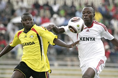 Kenyas Kevin Omondi battles Henry Kisseka of Uganda during their CHAN return tie at the Nyayo National Stadium.