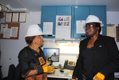 President Ellen Johnson Sirleaf chats with U.S. Ambassador Linda Thomas-Greenfield during the tour of an oil exploration rig.