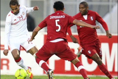 Tunisian players attempt to gain possession of the ball (file photo).