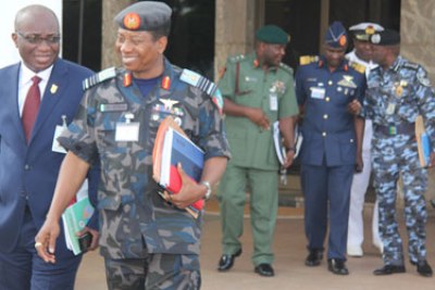 Chief of Defence Staff, Air Chief Marshal Oluseyi Petinrin (2nd left) and other security chiefs after a security council meeting