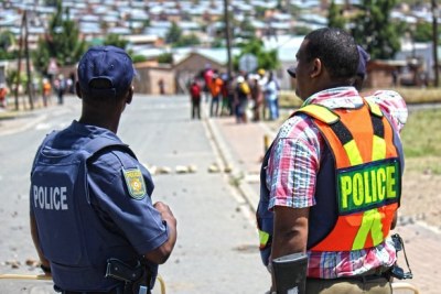 Police monitor demonstrators: Protests had spread across the winelands from De Doorns to Robertson, Wolesley, Ceres, Prince Alfred Hamlet and the surrounds.