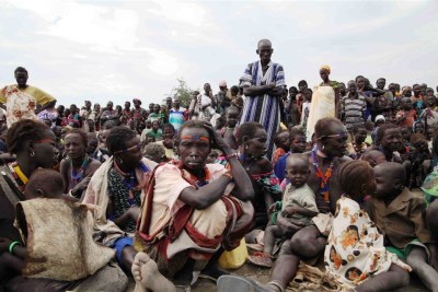 People displaced by clashes in South Sudan's Jonglei state wait for food distribution in Pibor.