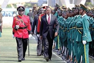 President Jakaya Kikwete inspects guard of honour to mark 51 years of independence.