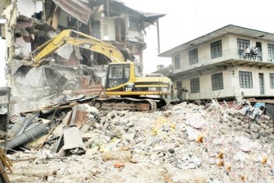 A bulldozer demolishing homes. (file photo)