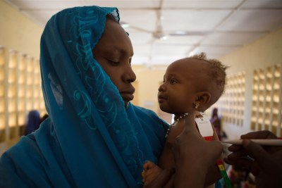 A baby gets her health and weight measured during a consultation at the referral health center in Gao, Mali. (file photo)