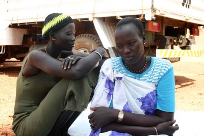 Two women sit at the UNMISS base in Rumbek, Lakes State, South Sudan.