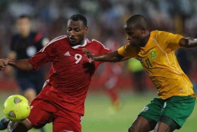 Bafana player fights for  ball during an AFCON clash against Sudan