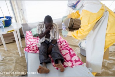 An Ebola patient receives treatment.