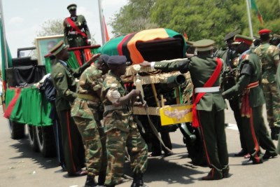 Soldiers carry the body of President Michael Sata in Lusaka.