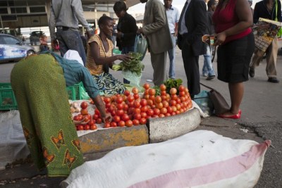 Vendors sell vegetables in Harare.