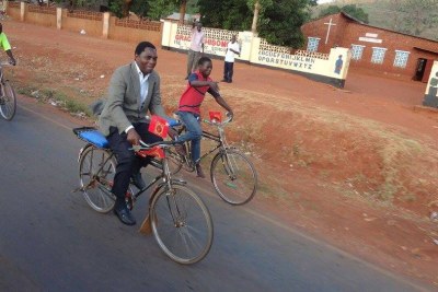 Opposition candidate Hakainde Hichilema cycles along a street in Zambia (file photo).