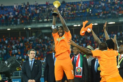 Yaya Toure holds aloft the African Cup of Nations trophy after Cote d'Ivoire won the 2015 final against Ghana in a penalty shoot-out in Bata on February 8.