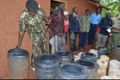 Police impounding illicit brew in Gikandu village, Murang'a county.