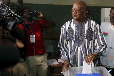 Roch Marc Christian Kabore votes during the presidential and legislative election at a polling station in Ouagadougou on November 29.