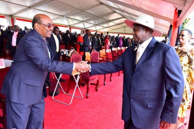 President Museveni (Right) greets Sudan’s Omar-al-Bashir at the former’s inauguration in Kampala.