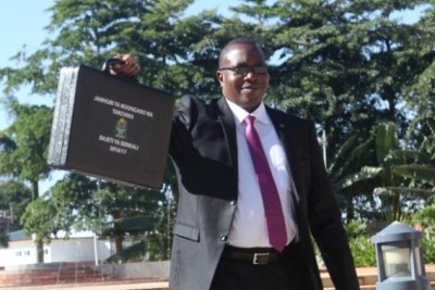 Finance and Planning Minister Dr Philip Mpango holds the briefcase containing the national budget moments before presenting it in the National Assembly in Dodoma.