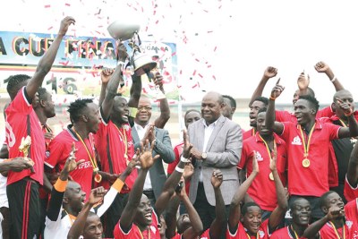 Vipers players celebrate winning the trophy.