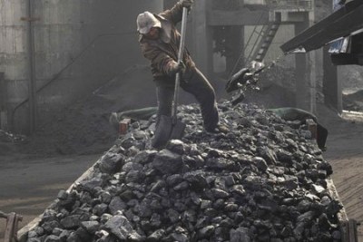 A worker loading coal (file photo).