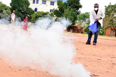 Samuel Mugarura demonstrates the effectiveness of one of his tear gas canisters.