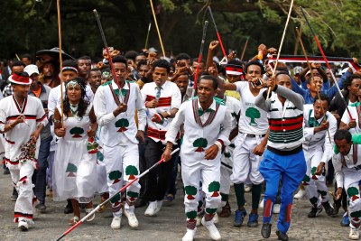 Demonstrators chant slogans while flashing the Oromo protest gesture during Irreecha, the thanksgiving festival of the Oromo people, in Bishoftu town, Oromia region, Ethiopia.