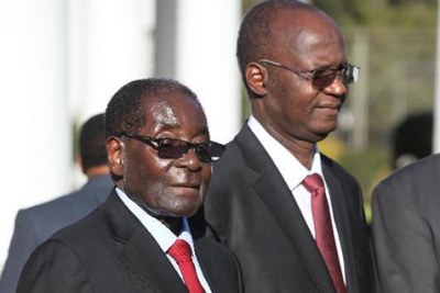 President Robert Mugabe and Higher and Tertiary Education minister Jonathan Moyo.