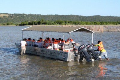 Learners at eNkovukeni, in the north of KwaZulu-Natal, cross the Makhuwulani Lake to get to school on a boat provided by the Department of Education.