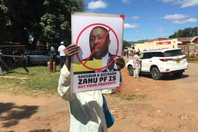 Zanu-PF supporters march against Saviour Kasukuwere.