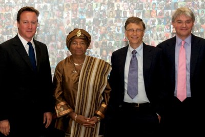 Then British Prime Minister David Cameron, Liberian President Ellen Johnson Sirleaf and then UK Secretary for International for International Development Andrew Mitchell at a 2011 vaccine alliance conference to promote childhood immunizations.