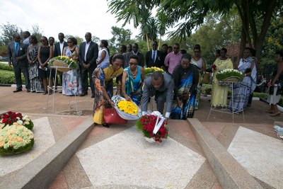 Family and friends lay wreaths on the graves of victims of the 1994 Genocide against Tutsi at a  commemoration event ( file photo)