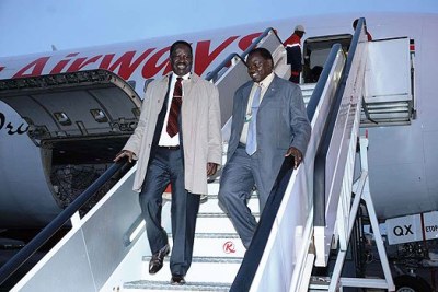 Raila Odinga (left) disembarks from a plane at JKIA (file photo).
