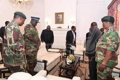 Service chiefs and then-president Robert Mugabe.