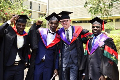 Isaac Kyazze with colleagues at Makerere University on January 17, 2018.