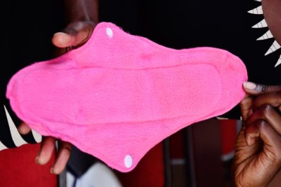 A reusable sanitary pad with flaps and fasteners at the side. With access to these, many girls would not absent themselves from school during menstruation.