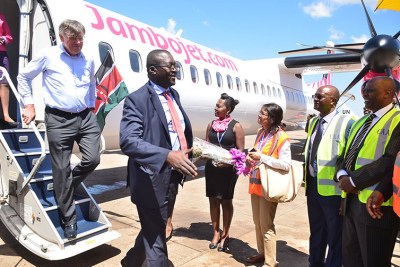Jambojet CEO Willem Hondius, left, disembarks with other airline officials.