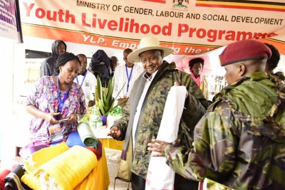 President Yoweri Museveni at an exhibition stall during Labour Day celebrations in Sembabule.