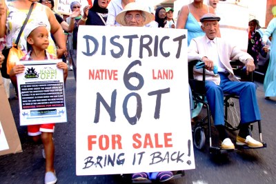 Yasiem Beckles, 4, Catherine Wagner, 91, and Cyril Wagner, 92, lead a march of land claimants from District Six to the Civic Centre (file photo).