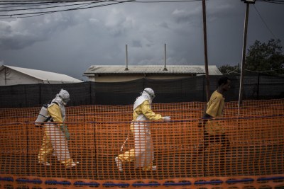 Health workers escort a new unconfirmed ebola patient to the reception, at a newly build MSF supported ebola treatment centre(ETC)  in Bunia (file photo).