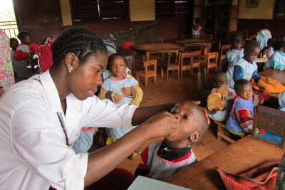 Vaccination team helping children at a nursery school (file photo).