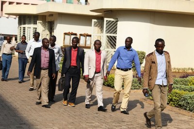 The nine Rwandans who were illegally deported from Uganda making their way to the Sub-Registry of the East African Court of Justice near the Supreme Court.