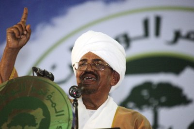 Sudanese President Omar Hassan al-Bashir addresses the general conference of the ruling National Congress Party in Khartoum, Oct. 23, 2014.