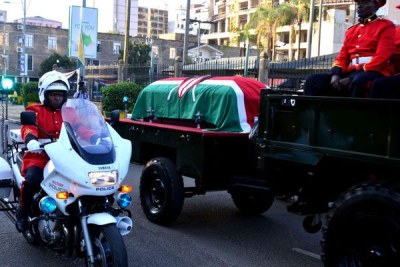 Officers of the Kenya Defence Forces accompany former President Daniel arap Moi's body to Parliament buildings on February 8, 2020 for three days of public viewing.
