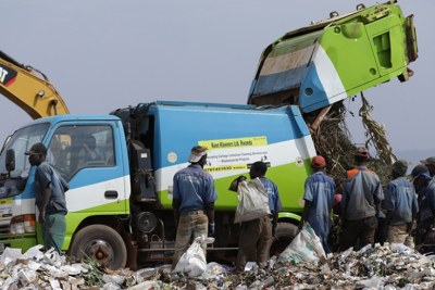 Workers sort garbage at Nduba dump site in Gasabo District.